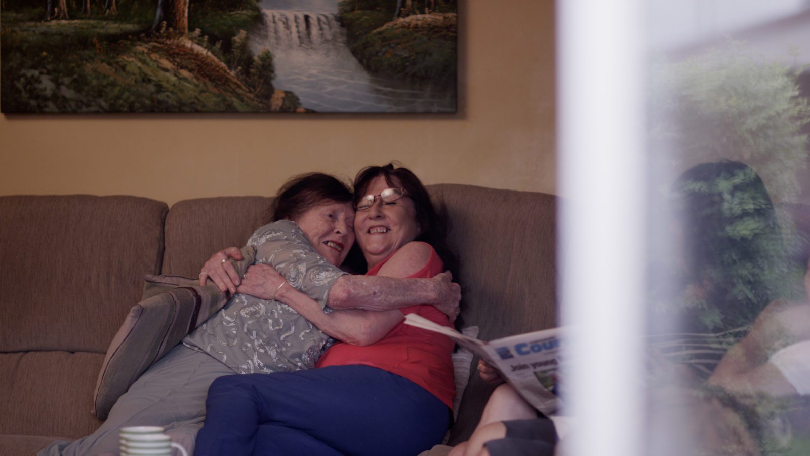 Adult mum and daughter hugging