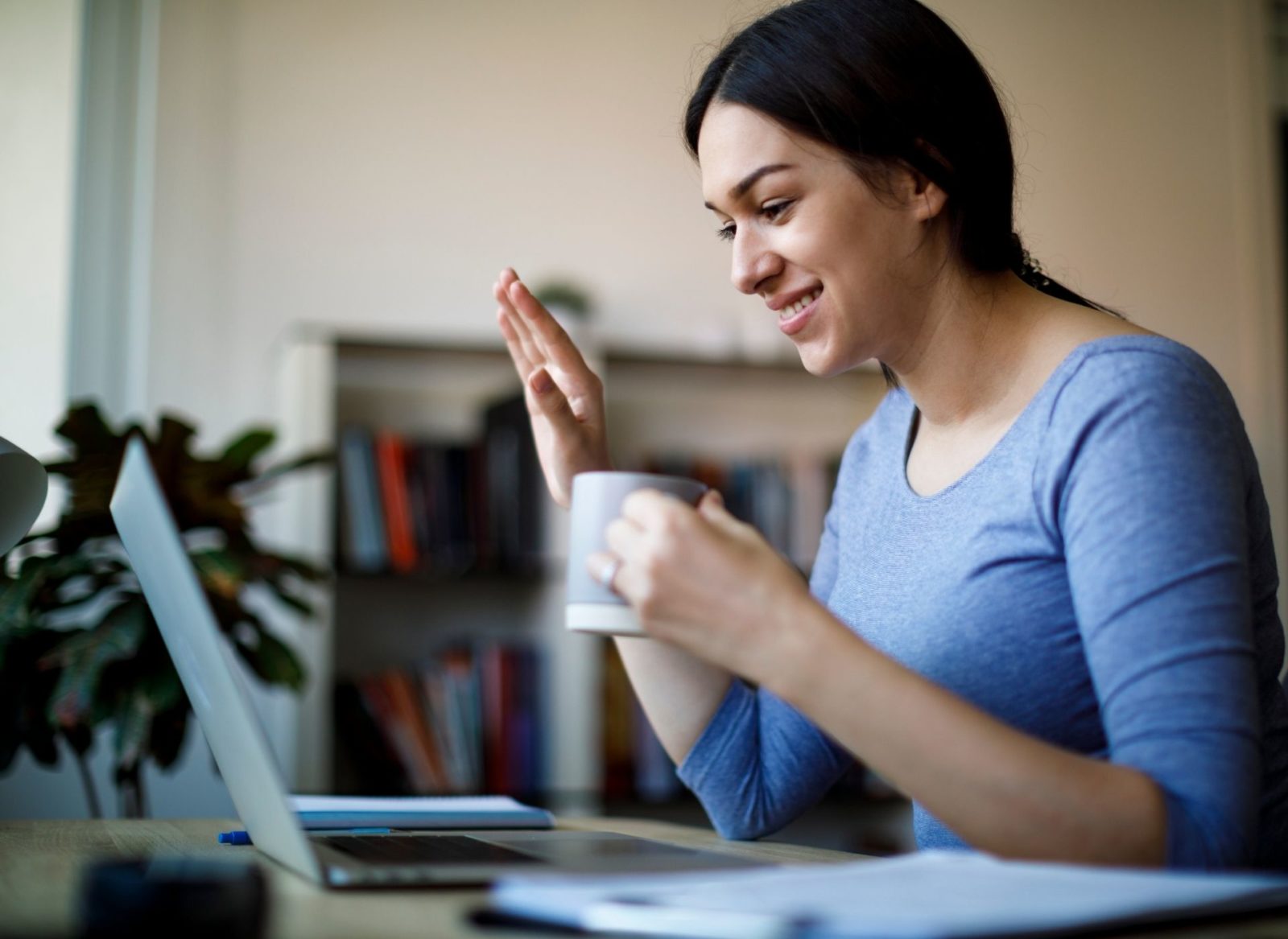 Parent attending an online support group for parents of a child with cancer