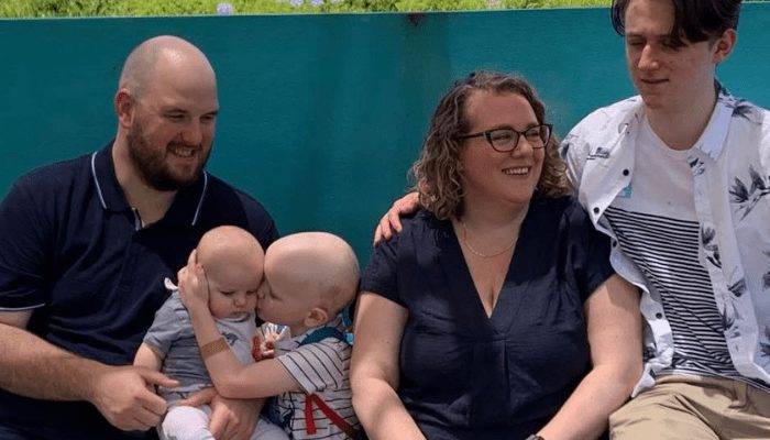 Mother, father and teenage son, baby son and four-year-old son who has cancer