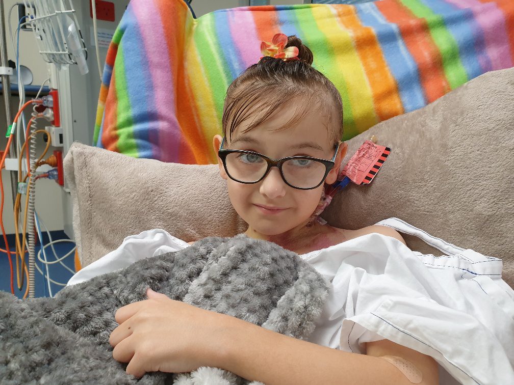 little girl in hospital bed with cancer