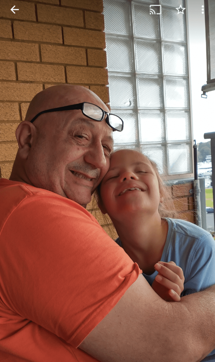 Bella and Ritchie hugging - dad and daughter - cancer